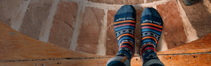 A pair of feet looking cozy in the Brownyn, the best wool socks for everyday wear